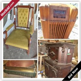 MaxSold Auction: This auction features an antique radio,thickness planer, desks, dressers, credenza, secretary desk, chairs and ottoman, bar server, coffee table, bench, cabinet, bent wood rocker, pine pantry, mantle and finials, vintage vanity, settee, wood planer, air compressor, band saw, drill press, antique cabinet, mirror, and more!