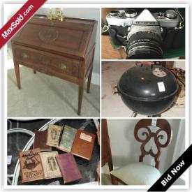 MaxSold Auction: This auction features antique books, wood display, glass decor, porcelain china collection, silverplate coasters, kitchen table, sewing table, Olympus camera and lenses, signed P. Martin on canvas, Weber charcoal grill, garden cart, chests, settee and pillows, blue arm chair and pillow, wood accent chair, and much more!