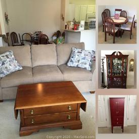 MaxSold Auction: This online auction features a tall cherry finish jewelry cabinet, Solid cherry curio cabinet with glass shelves and internal light, Lazy boy sofa, Cherry finish dinette set and much more.