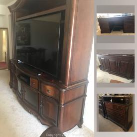 MaxSold Auction: This lot is a full apartment of LIKE NEW Cherry Wood Furniture. It features a queen-sized bed set; an executive desk, printer, and chair; two large dining room buffets; a wrap-around brown lecture sofa and a cabinet.