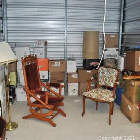 MaxSold Auction: This online auction is for a storage unit including furniture such as wooden chairs, glassware, home decor, floor lamps, dishware and much more