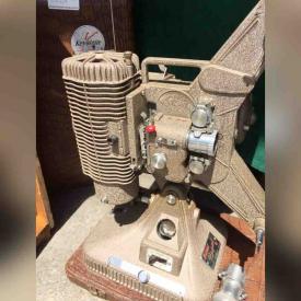 MaxSold Auction: This online auction features Keystone Regal 8mm Projector, Wood Crate, Wood Abstract Lamp, The House of Philip Oriel Chair, Christmas Ornaments, Vases, Planters and Candleholders, Cooking and Cleaning Supplies, Baking Racks, Six Prints, Lamps and much more!
