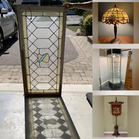 MaxSold Auction: This online auction features antique stained glass window, framed artwork, \nglassware, Tiffany style lamps, display cabinet, antique chair,  vintage posters, women’s clothing, home decor, area rug, Mikasa china and much more!