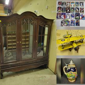 MaxSold Auction: This online auction features antique Mid-Century cabinet, beer steins, display cabinets, shelving unit, trading cards, signed prints, games, novel, vintage metal plane and much more.