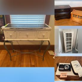 MaxSold Auction: This online auction features items like a file cabinet, trunk,  rugs, desk, books, or name ts, cabinet, kitchenware, glassware, camera, room divider, electric appliances, walla rt, music boxes, tables, wall mirror and much more!