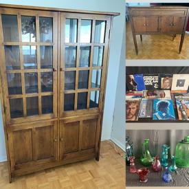 MaxSold Auction: This online auction includes furniture such as a table, bookshelves, wood desk, metal frame futon, wood chair, china hutch and others, servingware, pitchers, poetry, decor, manual flower presses, books, vinyl records, dragon decor, rugs, silverware, fans and much more!