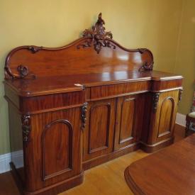 MaxSold Auction: Features Leather bound Charles Dickens series books, chandelier, Mahogany crank dining suite, art including oil on board, early desk with upper glass book case, stained glass hanging light fixture and much more!