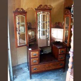 MaxSold Auction: This online auction features ANTIQUE: Vanity, mirror, trunk and end table. a Magic Chef refrigerator. Baking mold collection; crystal/glass; copper. VINTAGE: Waterfall chest to of drawers and much more!