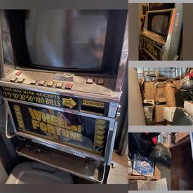 MaxSold Auction: This online auction features a storage unit with photography items, lamps, slot machine, tools, jewelry, and more.